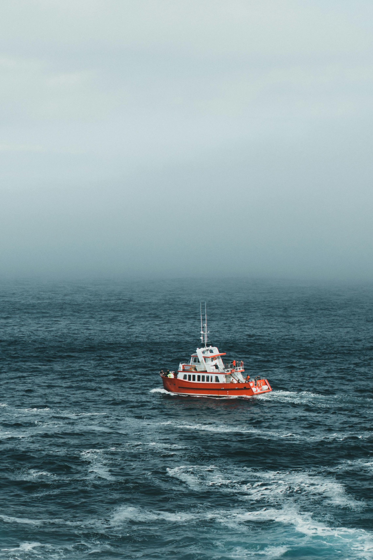Research vessel on a foggy open sea